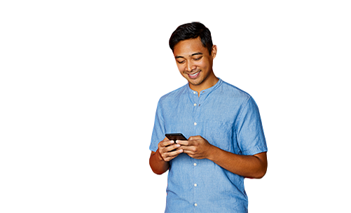 An image of a man holding a phone smiling